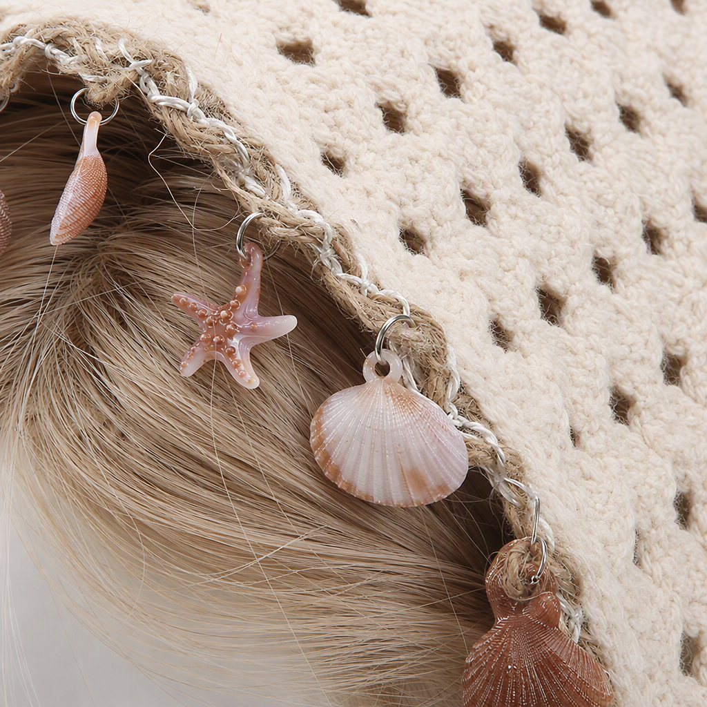 A creative handmade accessory display prop featuring a beige crocheted headscarf decorated with a shell and starfish pendant and a dummy head model Application Scenario
