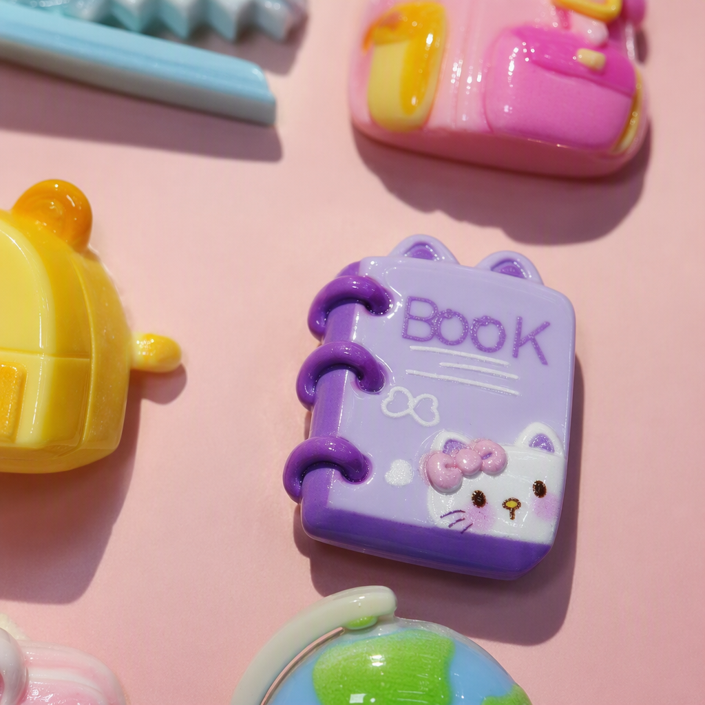 Pink card, six cartoon stationery pendants, blue whale, pink schoolbag, yellow bear bag, purple notebook, rabbit-shaped pencil case, globe decoration Application Scenario