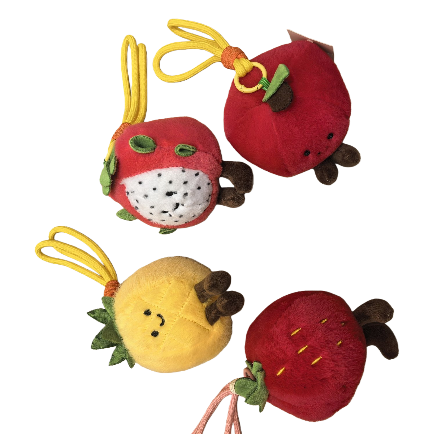 Four cute fruit-shaped plush pendants: red strawberry pitaya and yellow pineapple. Fun handcrafted fabric pendants for gift bags Item Picture