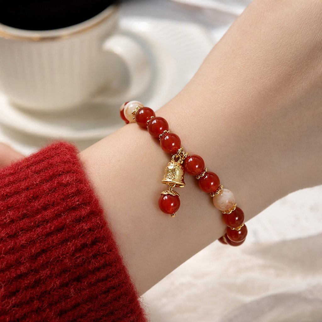 A red agate bracelet paired with a golden bell pendant is a fashionable couple gift. It's a trendy choice for your girlfriend or best friend details Picture
