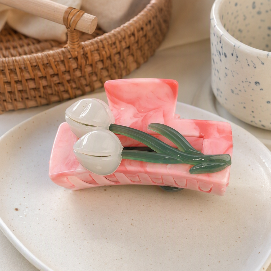 Pink marble-patterned hair clips, white flowers and green stems embellish fashionable hair accessories and hairstyle ornaments details Picture