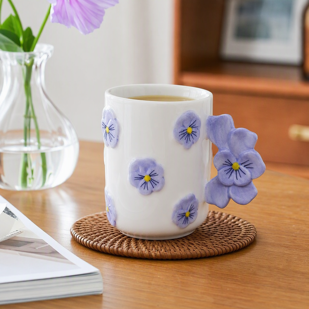 White ceramic cups, purple pansies with floral decorations, simple and creative coffee and tea sets, household and office supplies details Picture