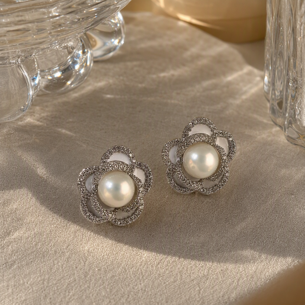 Silver flower-shaped pearl stud earrings are simple, fashionable, versatile and elegant. They are a perfect accessory for women details Picture