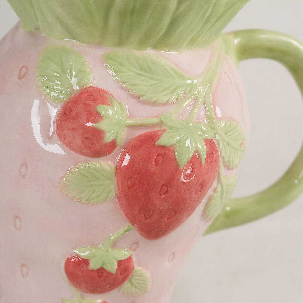 Pink strawberry-shaped ceramic water bottle, creative household hot drink pot, cute and portable tea set decoration Application Scenario