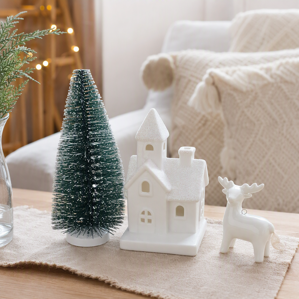 White Christmas house, white reindeer ornaments, green cedar trees, festive decorations, Christmas home arrangements, Christmas gifts details Picture
