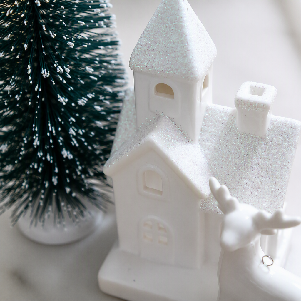 White Christmas house, white reindeer ornaments, green cedar trees, festive decorations, Christmas home arrangements, Christmas gifts Application Scenario