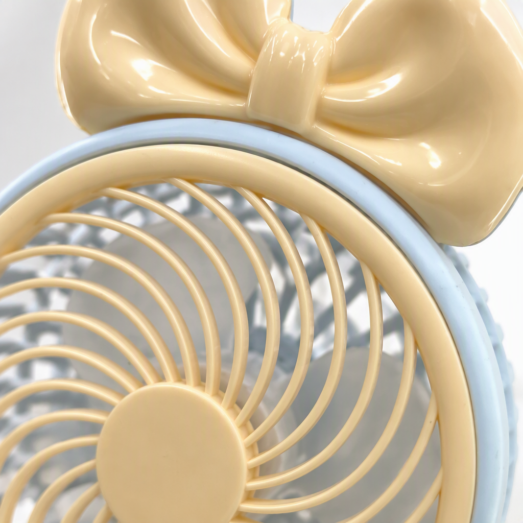The fresh light blue bow fan is a portable, silent, handheld mini and fashionable student dormitory fan for summer Application Scenario