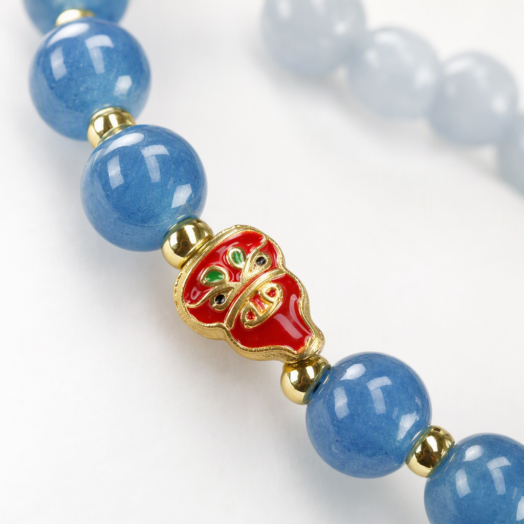 Blue beaded mobile phone lanyard with red gold edge decorative small beast pendant, fashionable and trendy accessory gift Application Scenario