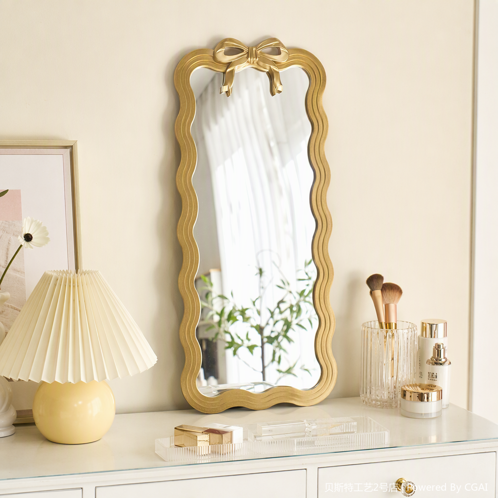 A golden wavy border with a bow decorative mirror, a fashionable and simple home decoration, a bedroom dressing mirror ornament details Picture