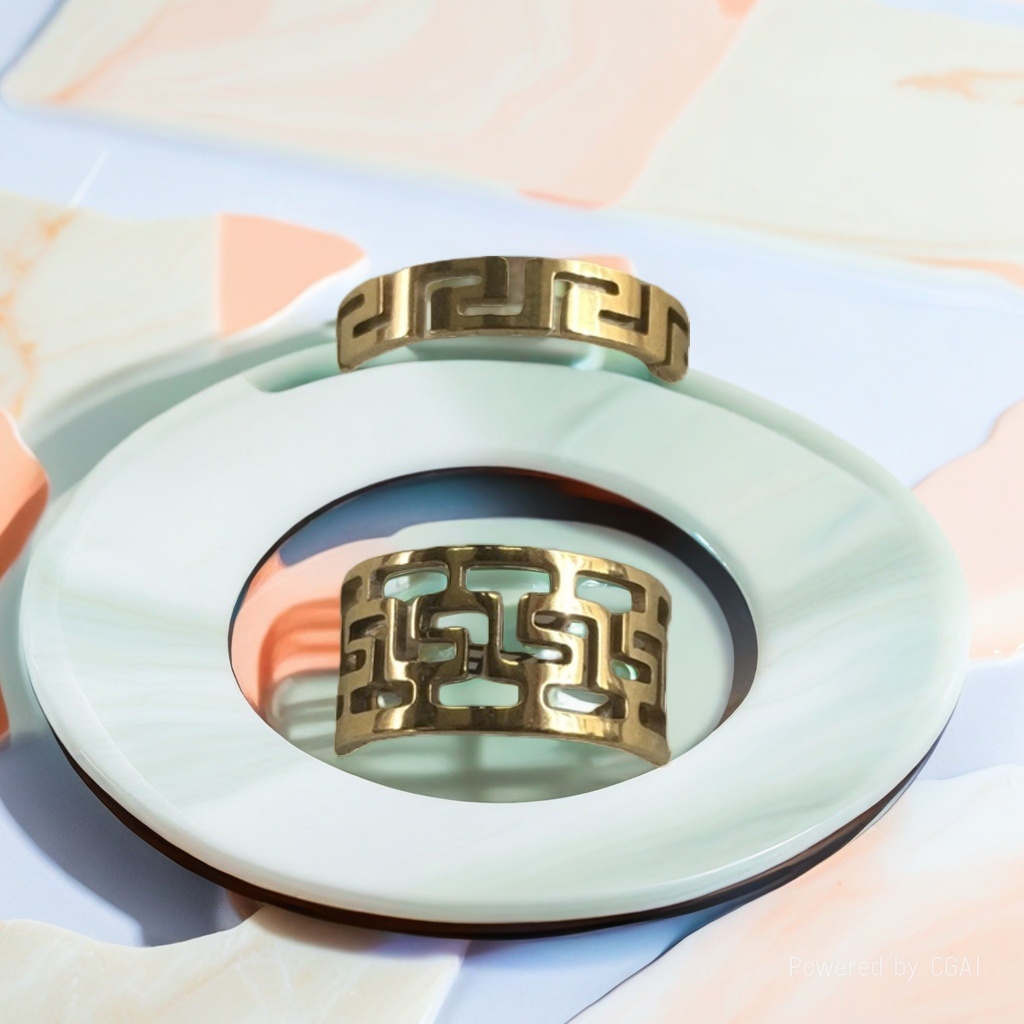 A stainless steel Catholic female ring with golden geometric patterns
