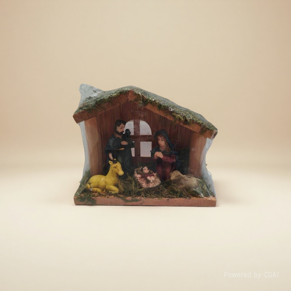 A miniature manger model of the Holy Family of three and animals in a Christmas scene