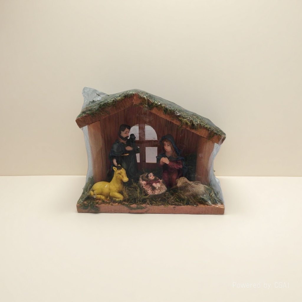 A miniature manger model of the Holy Family of three and animals in a Christmas scene details Picture