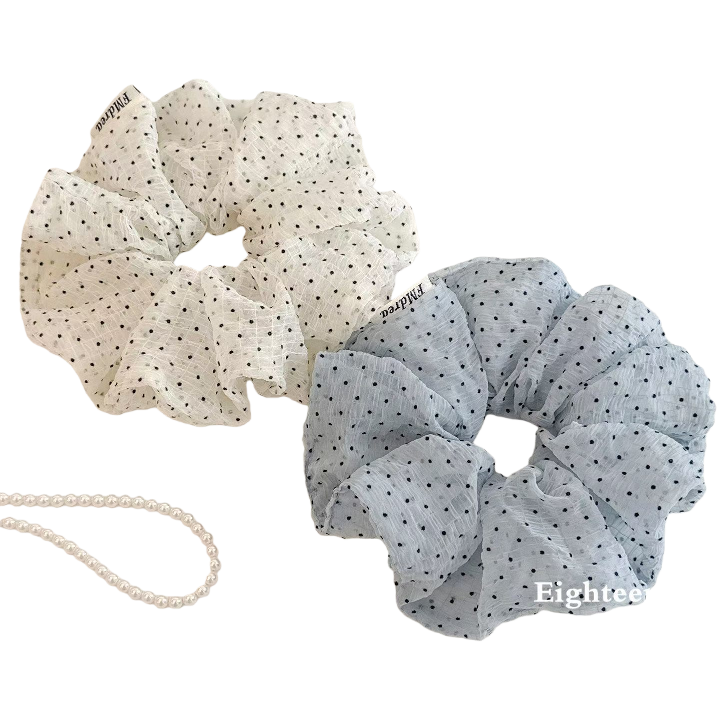 The Korean-style polka dot wrinkled checkered large intestine hair band exudes a fresh and sweet charm. It is fashionable with a hair tie and bun hairstyle Item Picture