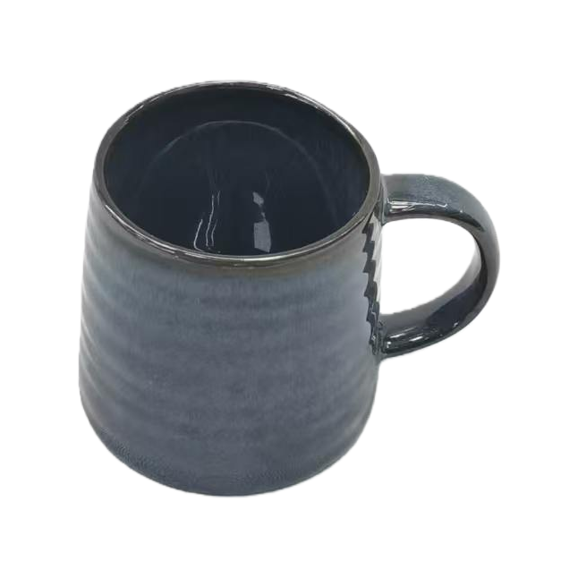 Dark blue ceramic cups with stainless steel tableware set and wooden soup spoons Dark blue ceramic cups with stainless steel tableware set and wooden soup spoons