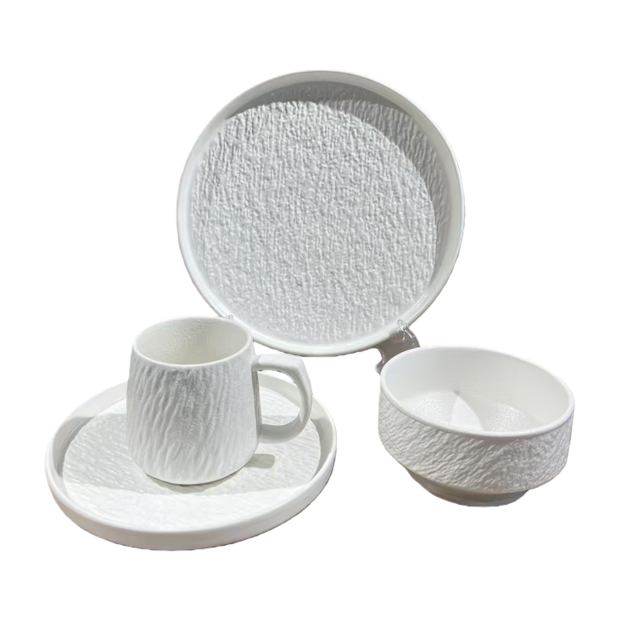 White textured ceramic tableware set including plates, cups, bowls and chopsticks. Ceramic bowl set