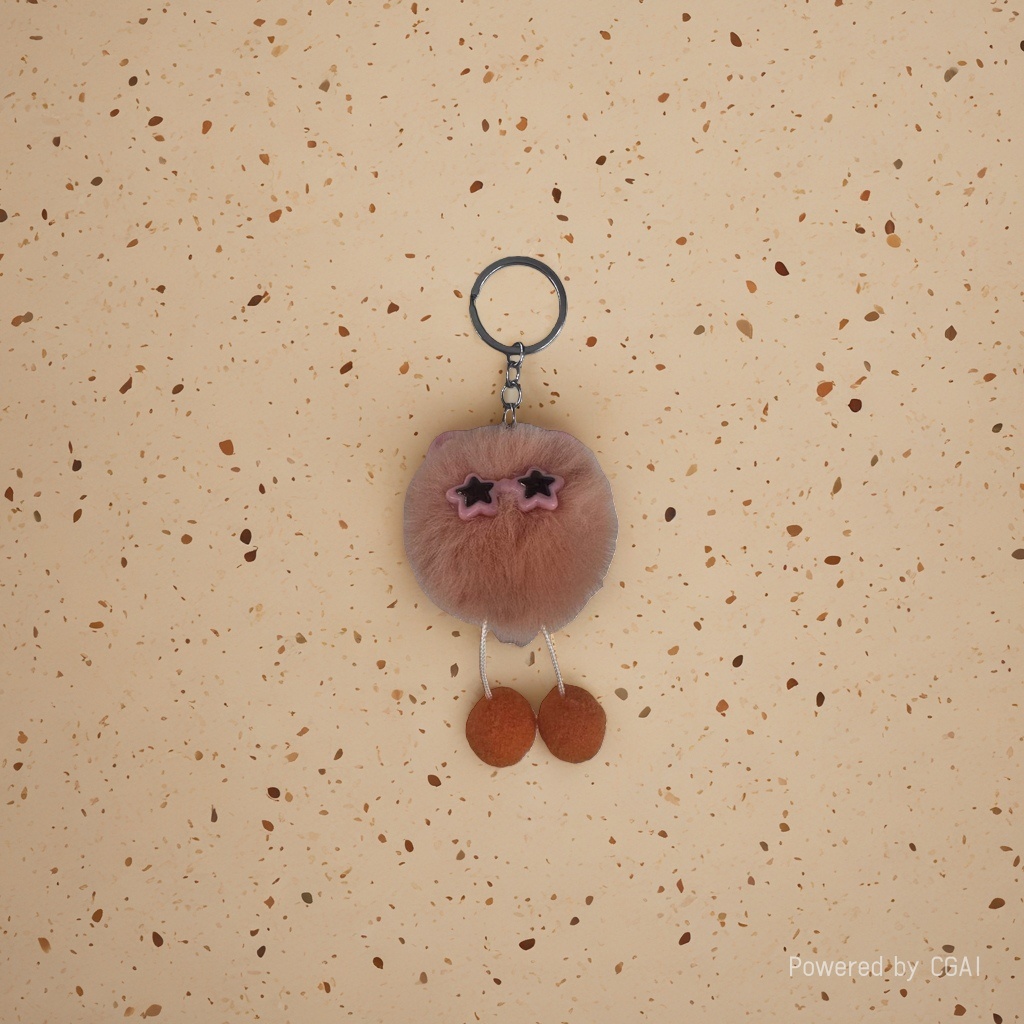 Orange toy pom-pom big toothy key chain with a bell Application Scenario
