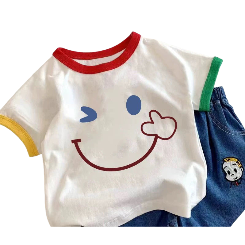 A white T-shirt with a colorful smiling face pattern on the sleeve is paired with blue denim shorts Item Picture