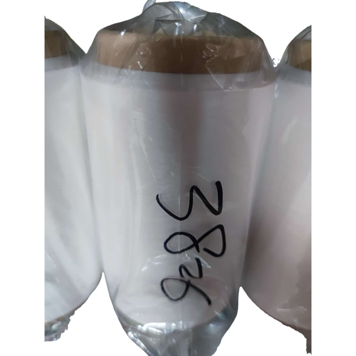 White spool surface with handwritten numbers 3826 for industrial sewing machine accessories Item Picture