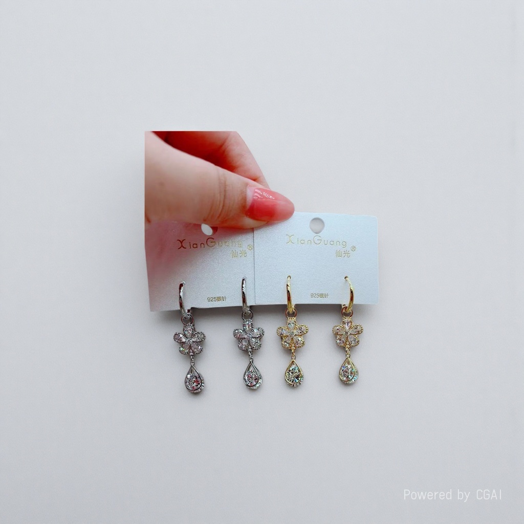 Holding four pairs of flower water drop earrings, silver and gold bicolored crystal stones set with 925 silver needle antique style earrings details Picture