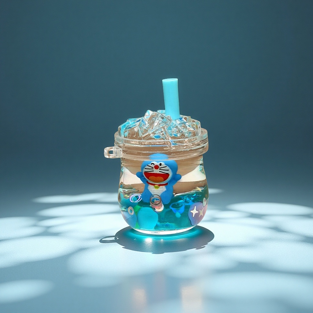 Creative acrylic oil-impregnated sand bottle, blue cartoon keychain, perfume, car accessories, desktop ornaments and ornaments Application Scenario