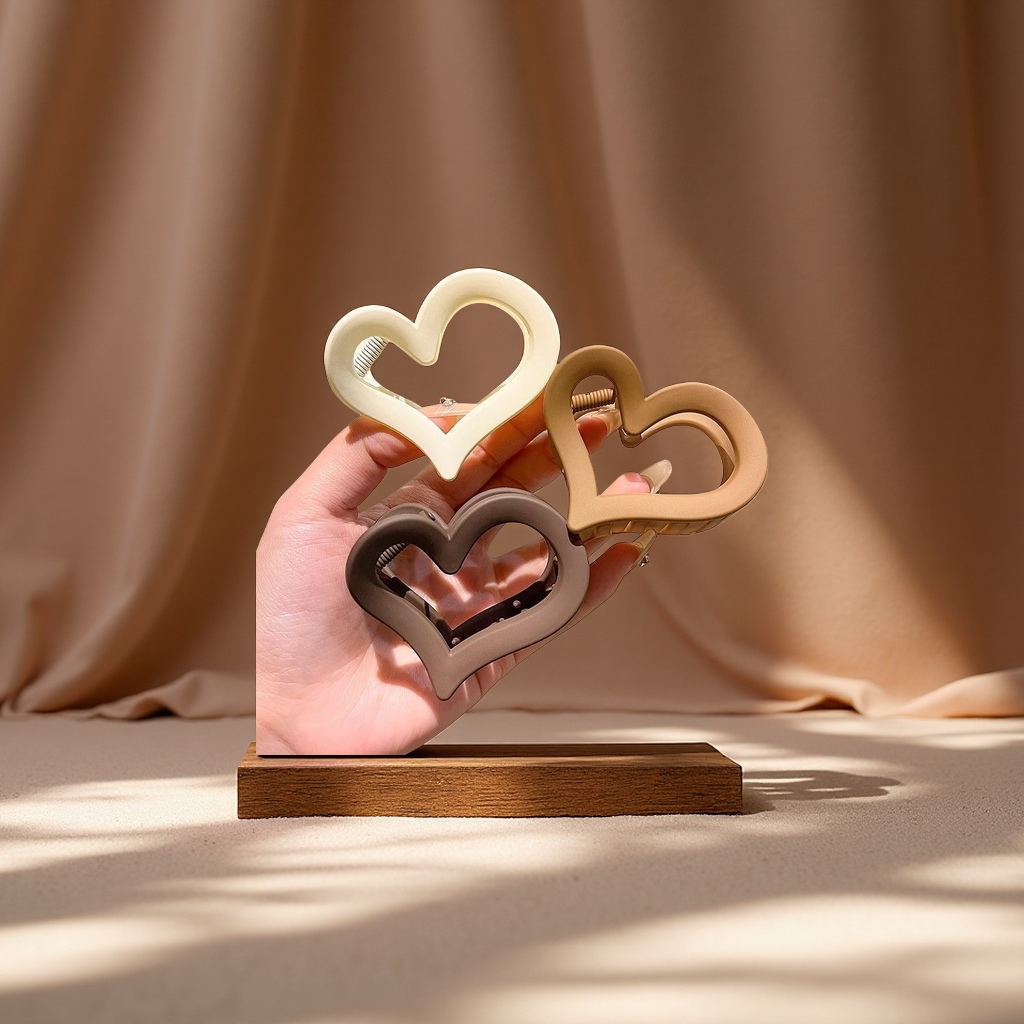 25年奶咖四色镂空发夹后脑勺盘发抓夹百搭爱心形简约头饰发饰品产品图