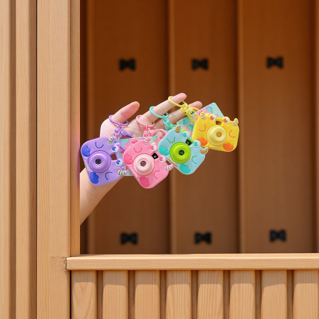 Cute cartoon red panda, projection camera, keychain, creative car bag, pendant, key chain, small gifts, wholesale accessories details Picture