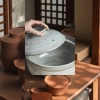 The Kangshu stew pot, with its double lid for cooking rice, is a clay pot and enamel kitchenware that is durable and keeps warm Application Scenario
