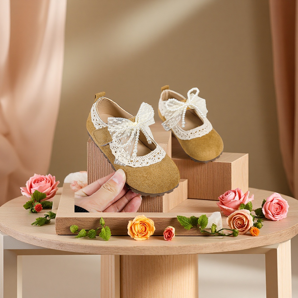 A cute little bear-shaped warm scarf and hat in one piece for a baby girl in winter