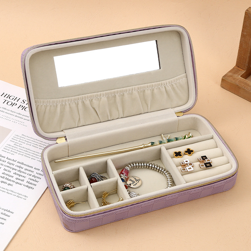 The 2025 new minimalist leather jewelry box features a dust-proof flip cover design, with separate storage areas for earrings and rings. It is a portable daily necessities storage basket with a storage basket Specification image