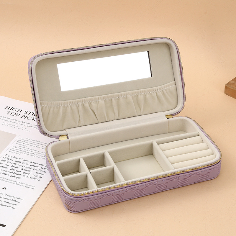 The 2025 new minimalist leather jewelry box features a dust-proof flip cover design, with separate storage areas for earrings and rings. It is a portable daily necessities storage basket with a storage basket details Picture