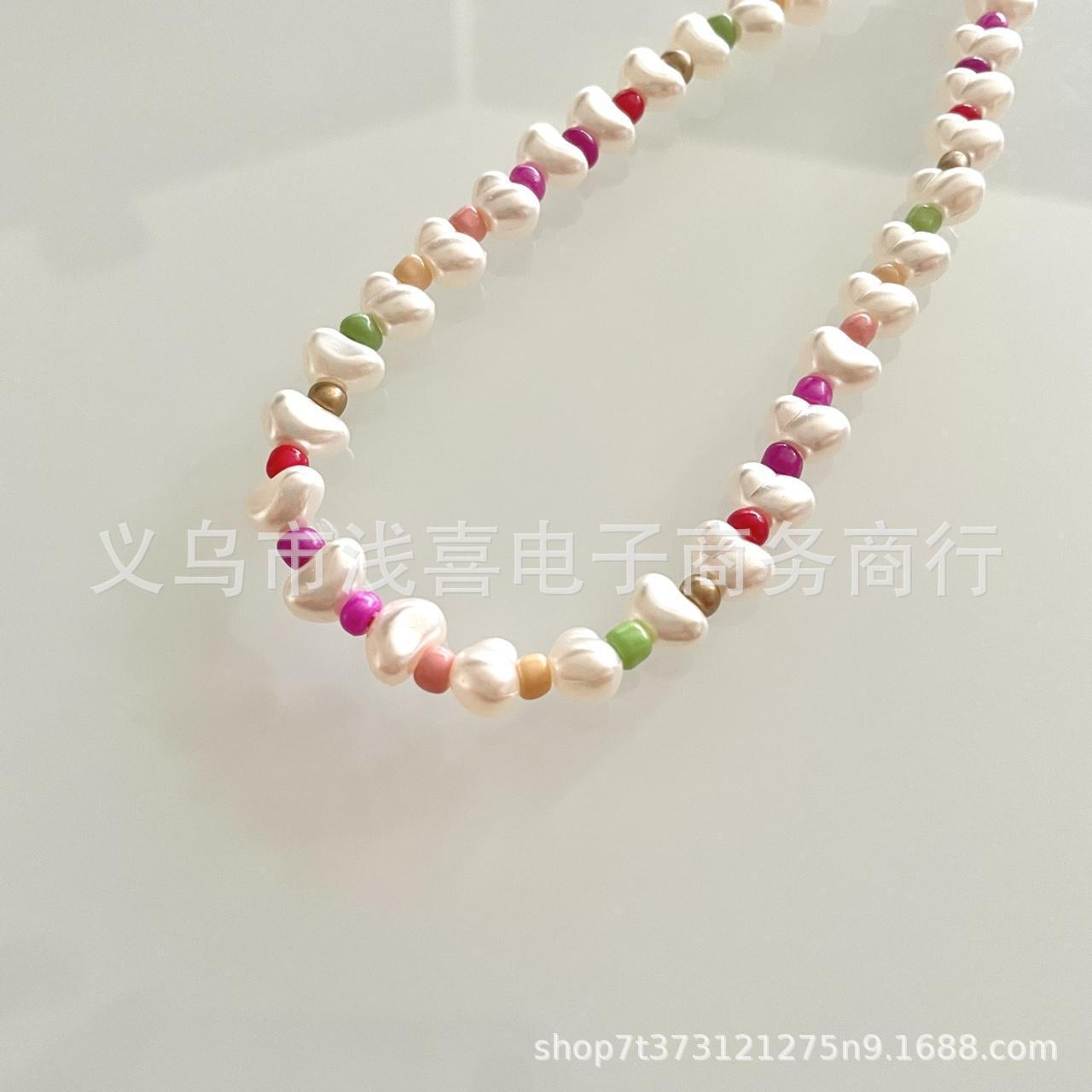 ins新款珍珠元宝爱心形手机链可爱粉色系手工串珠挂饰手机挂绳女饰品配件散珠串珠 Application Scenario