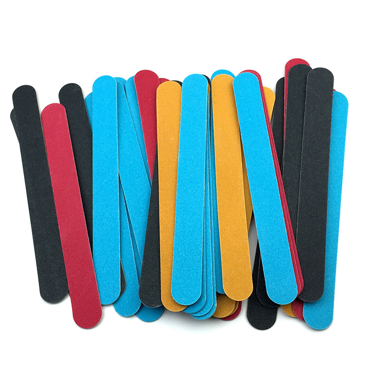 nail file in stock: Thin black sandpaper strips, brown wood chips, nail surface polishing tools, nail files pic 5