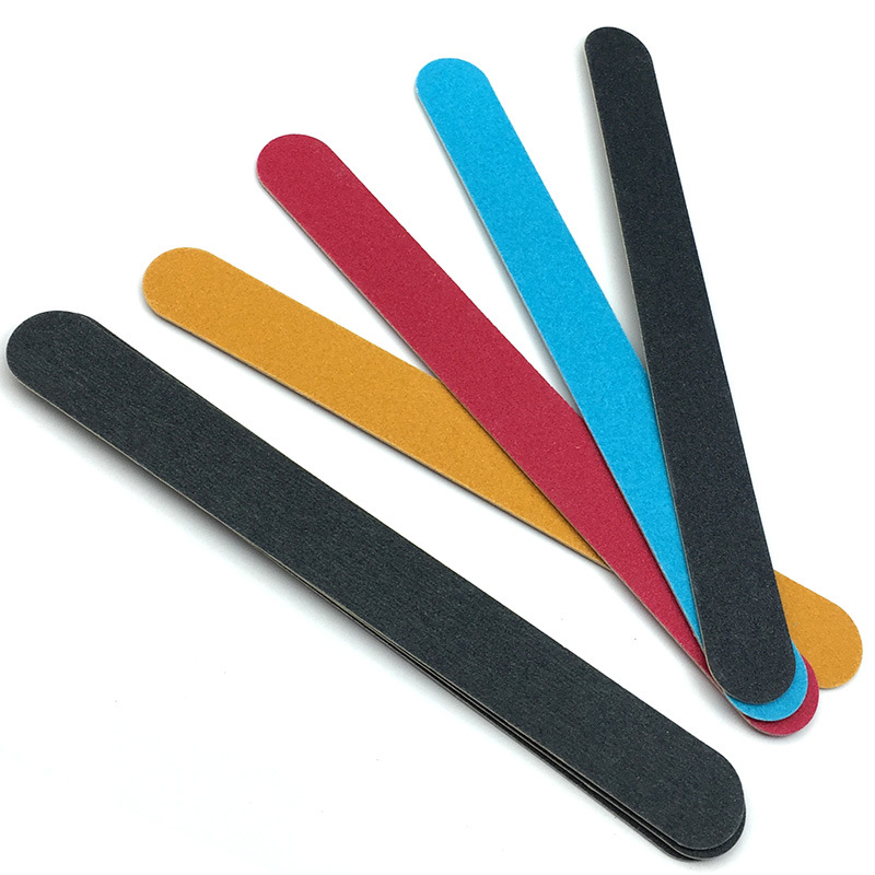 nail file in stock: Thin black sandpaper strips, brown wood chips, nail surface polishing tools, nail files pic 6