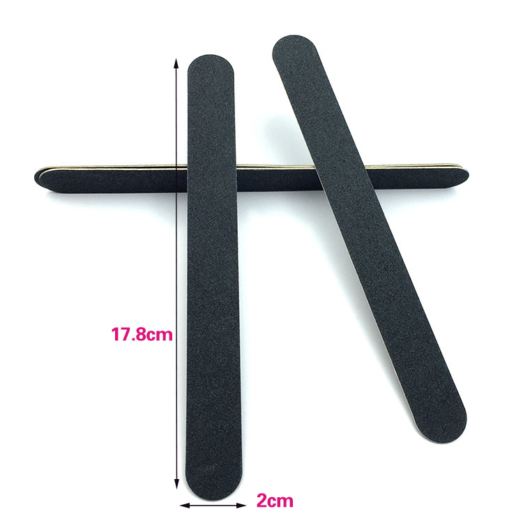 nail file in stock: Thin black sandpaper strips, brown wood chips, nail surface polishing tools, nail files pic 2