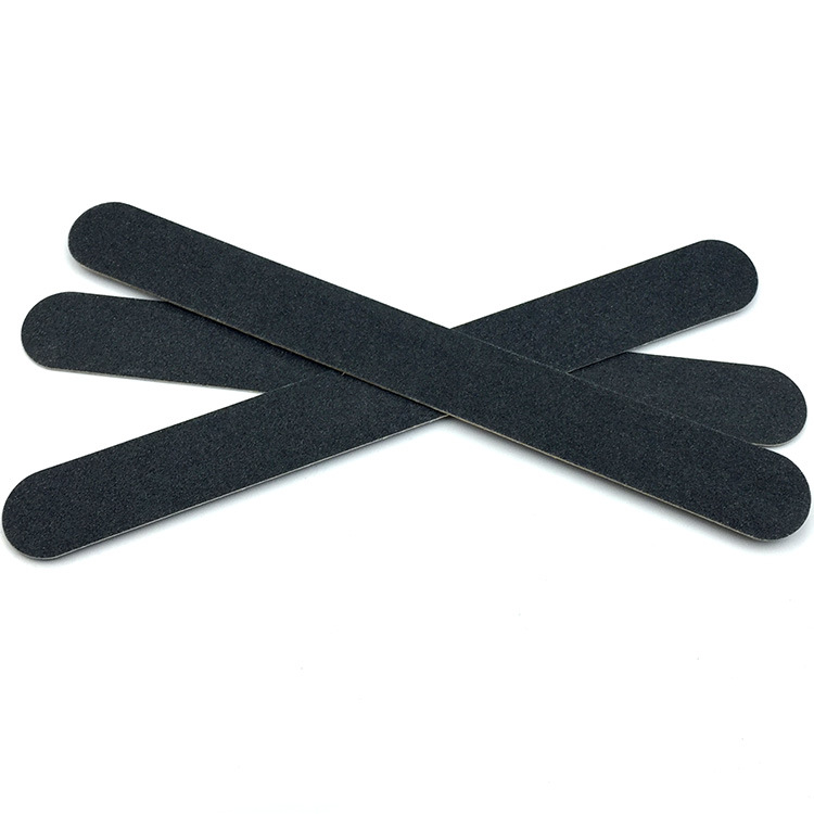 nail file in stock: Thin black sandpaper strips, brown wood chips, nail surface polishing tools, nail files pic 11