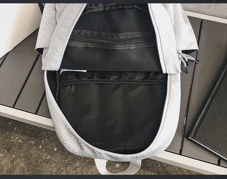 The new sports backpack with cracked white cement for boys and girls is a sporty, casual and fashionable travel backpack that is cool and trendy pic 15