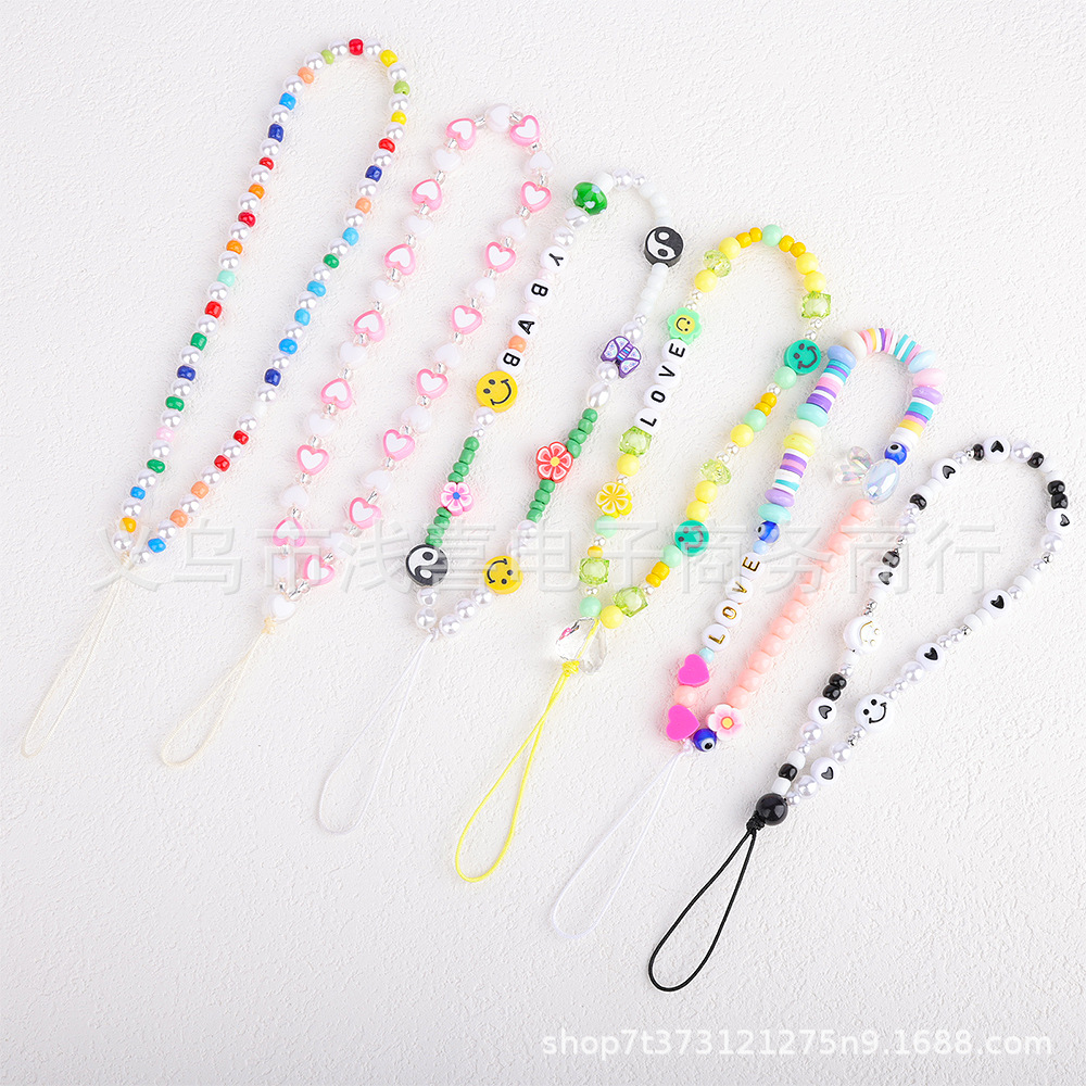 New colored rice bead mobile phone chain from ins in Europe and America, pearl smiling face beaded heart-shaped mobile phone accessory pendant for women pic 2