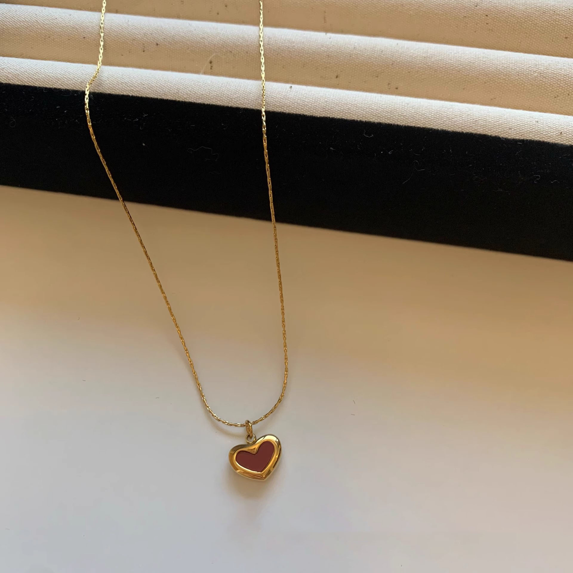 Red heart-shaped titanium steel necklace, small red heart pendant, Korean niche sweet autumn and winter energetic girl heart collarbone chain pic 1