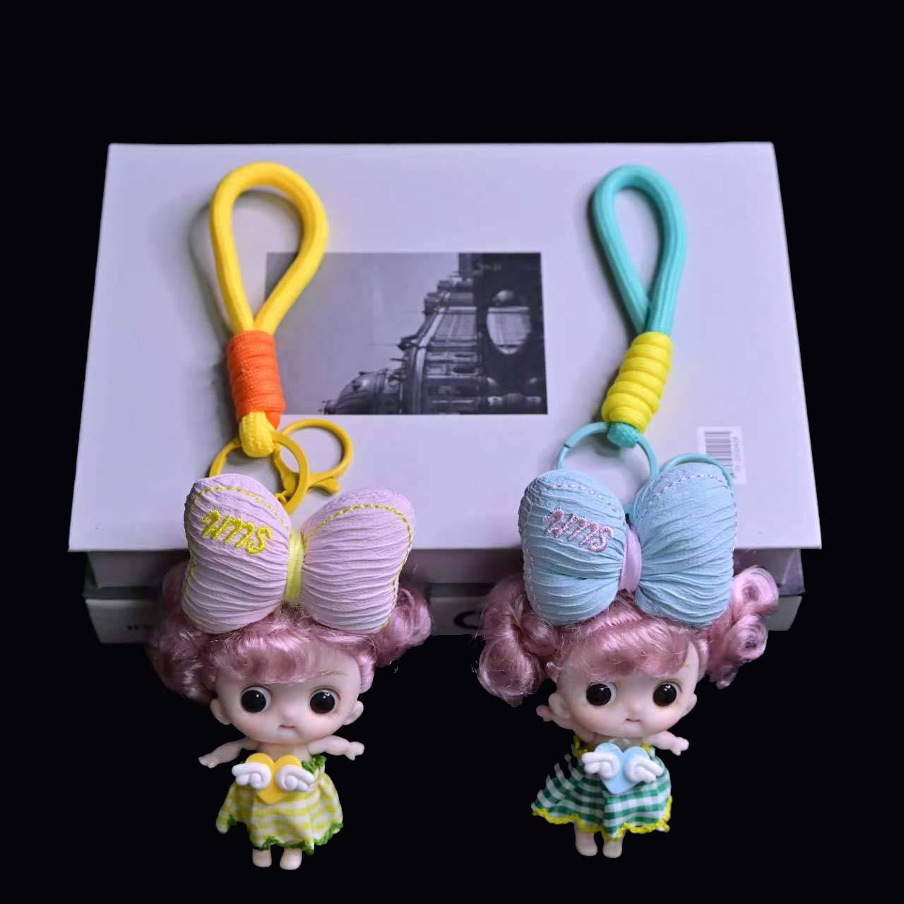 卡通立体呆萌头顶大蝴蝶结娃娃公仔挂件精品钥匙扣零钱包挂件批发详情8