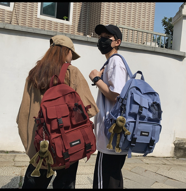 休闲百搭男女双肩包可爱挂件洋气潮流学生书包大容量工装风背包详情8