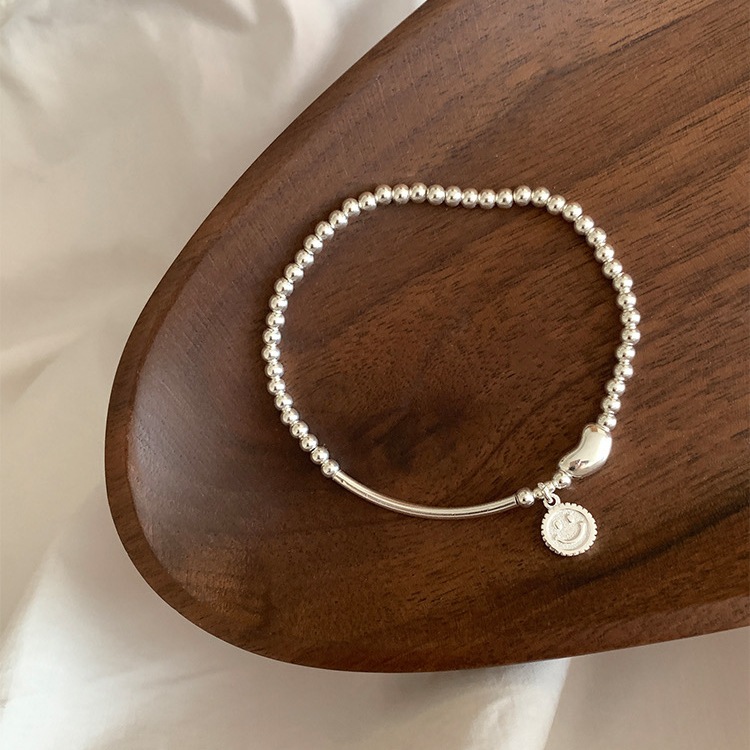 S925 sterling silver smiley face bean elastic beaded bracelet: simple and versatile, light luxury, ins niche jewelry with a sense of sophistication pic 1