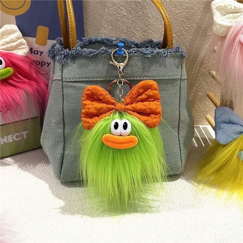 可爱蝴蝶结怪兽娃娃钥匙扣卡通搞怪毛绒书包挂件丑萌玩偶挂饰礼品详情3