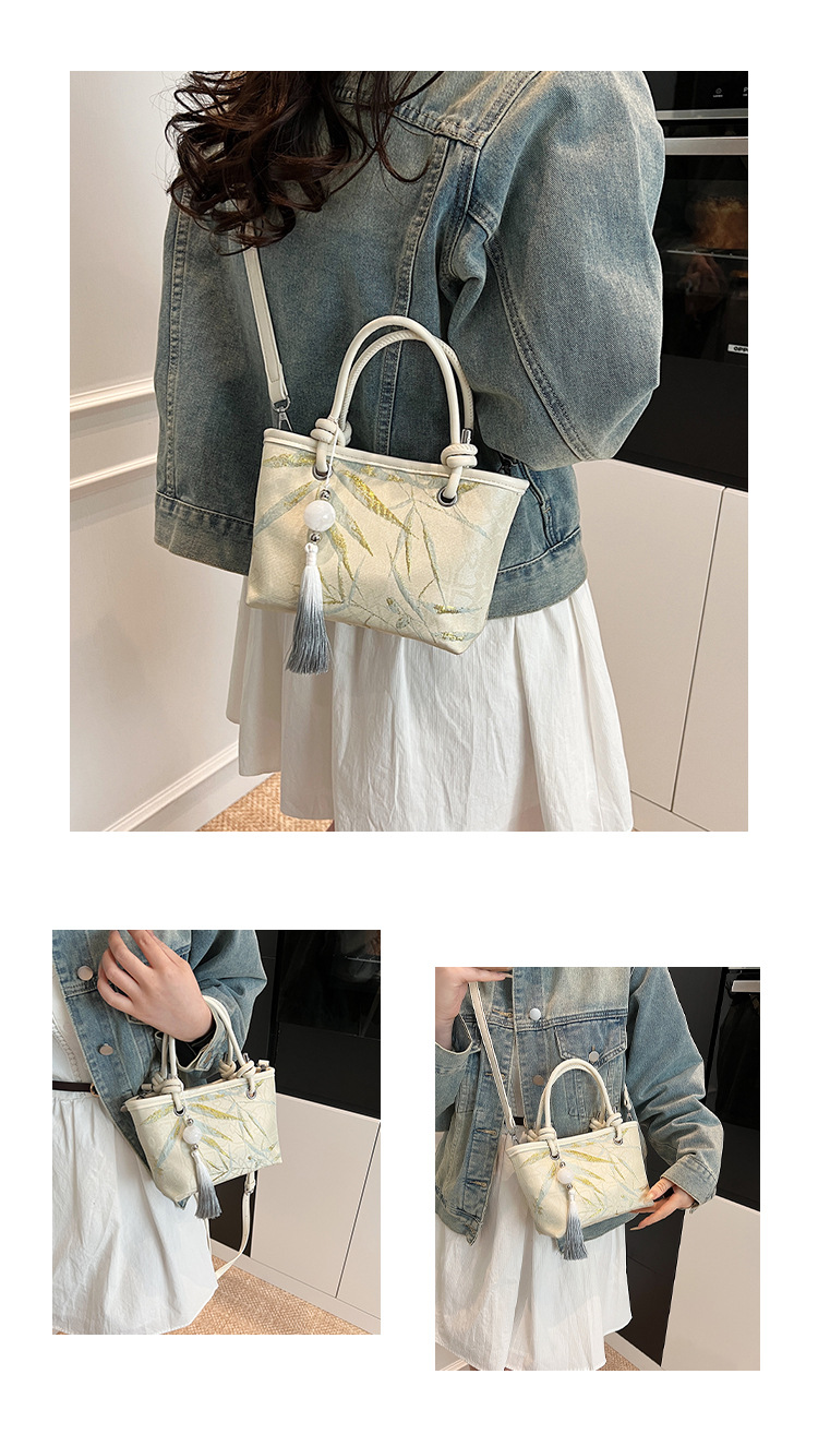 手拎新国潮式刺绣包包女2025春夏新款国风绣花时尚水桶包百搭斜挎包详情10