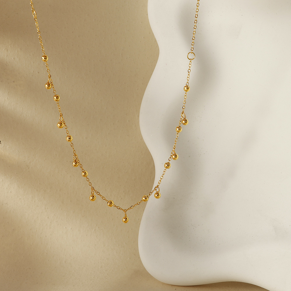 A popular 18K gold bean-shaped tassel necklace in Europe and America, featuring a minimalist and high-end look, is a versatile titanium steel collarbone necklace that goes well with a cold style on Instagram pic 4