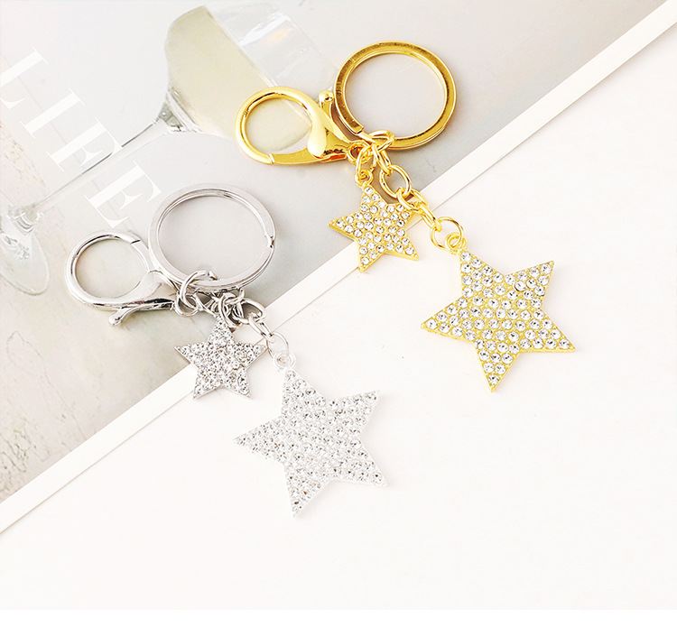 Wholesale of cross-border fashion diamond-encruted five-pointed star bags, keychains, metal star pendants and small gifts pic 1