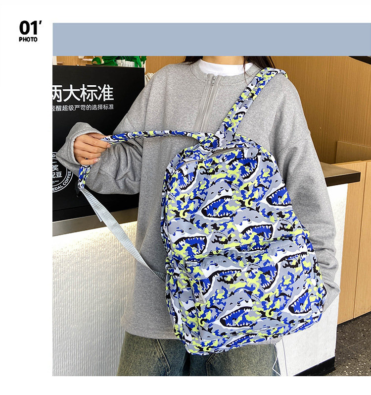 2024新款超轻大容量时尚潮流双肩包男简约电脑包背包中小学生书包详情2