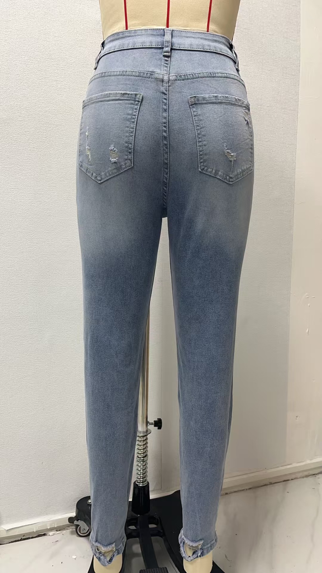 Factory direct sales of cross-border 2025 European and American new style stretch jeans for women, long ripped mid-waist and small-leg pants for women pic 4