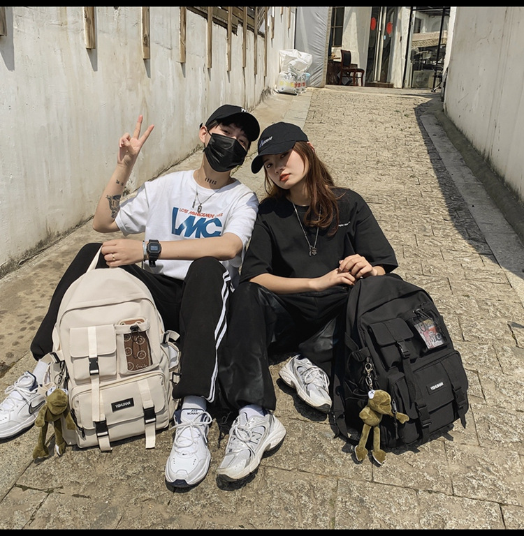 休闲百搭男女双肩包可爱挂件洋气潮流学生书包大容量工装风背包详情19