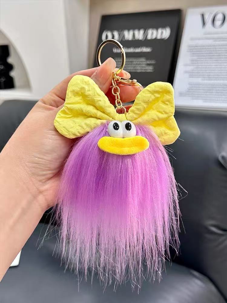 可爱蝴蝶结怪兽娃娃钥匙扣卡通搞怪毛绒书包挂件丑萌玩偶挂饰礼品详情5