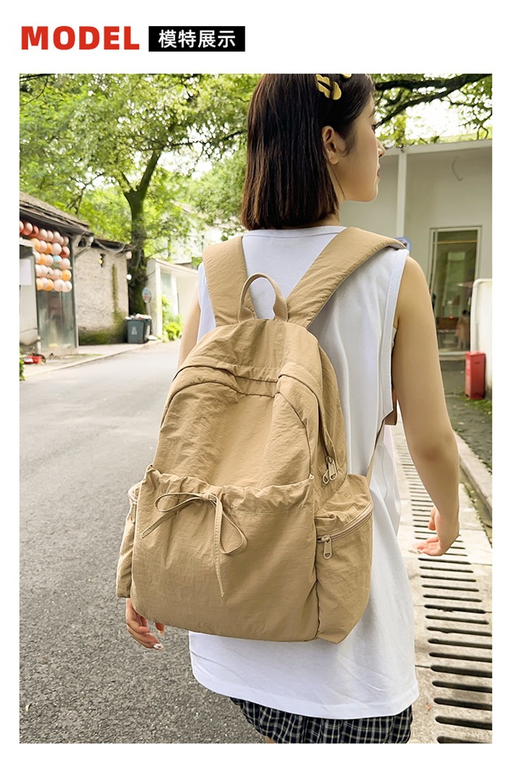 新款时尚轻便简约双肩包女日系文艺学生书包休闲运动旅行纯色背包详情6